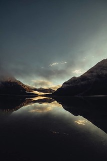 Sunrise with reflections in the Plansee in Tyrol in the Alps in Austria