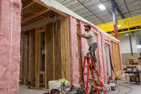 Romulus, Michigan - Workers build apartments in Ginosko Modular 's factory using modular