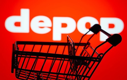 Dhaka, Bangladesh- 03 July 2025: Silhouette of a shopping cart in front of the Depop logo,