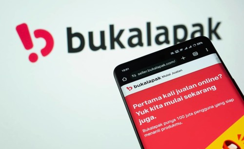 Dhaka, Bangladesh- 03 July 2025: Smartphone displaying Bukalapak web interface against Bukalapak