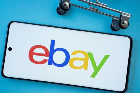 Dhaka, Bangladesh- 03 July 2025: Smartphone screen showing the eBay logo with shopping cart wheels