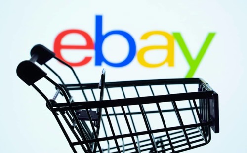 Dhaka, Bangladesh- 03 July 2025: Silhouette of a shopping cart in front of the eBay logo,