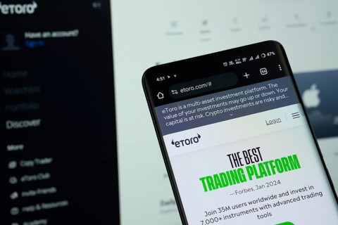 Dhaka, Bangladesh - 15 July 2025: The logo of eToro is displayed on a smartphone screen, and the