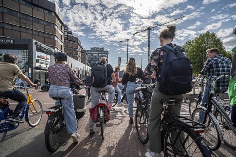 Ride your bike on the central cycle path on Lange Viestraat, Vredenburg, in the city centre of