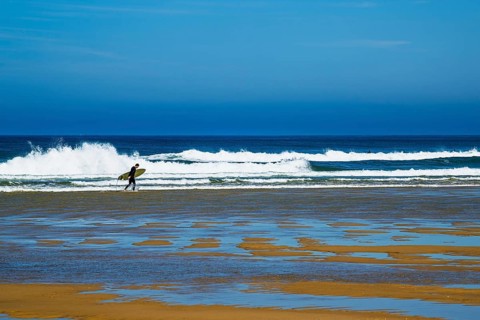 Surfer on Contis beach, Saint Julien en Born, Saint-Julien-en-Born, Landes, France