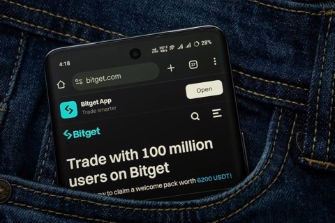 Dhaka, Bangladesh- 15 June 2025: A smartphone displaying the (--).com web interface peeks out of a