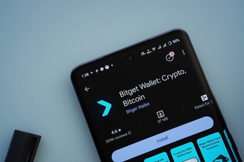 Dhaka, Bangladesh- 29 May 2025: On a blue surface, a smartphone displays the Bitget Wallet app