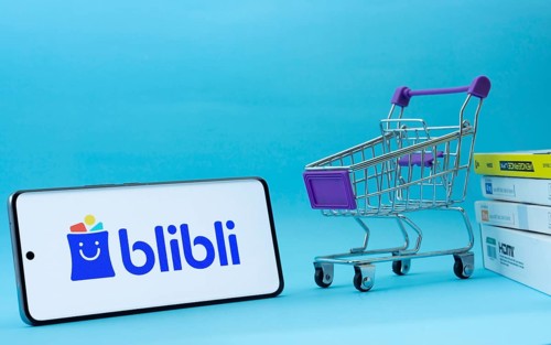 Dhaka, Bangladesh- 03 July 2025: Smartphone with Blibli logo next to a small shopping cart and