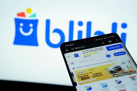 Dhaka, Bangladesh- 03 July 2025: Smartphone displaying Blibli web interface against Blibli logo