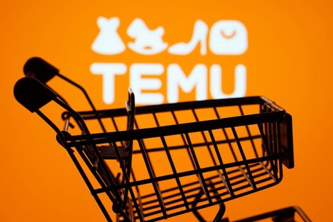 Dhaka, Bangladesh- 03 July 2025: Silhouette of a shopping cart in front of the Temu logo,