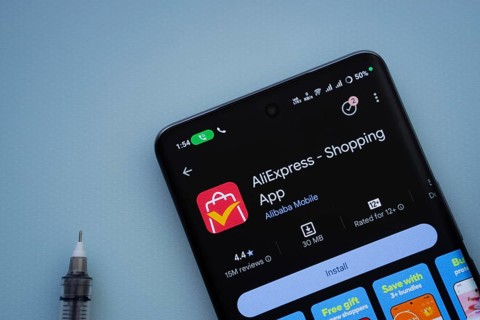Dhaka, Bangladesh- 29 May 2025: On a blue surface, a smartphone displays the AliExpress app within