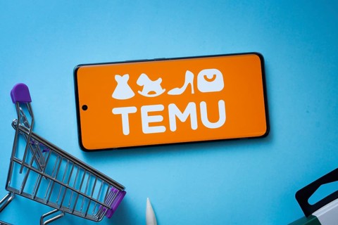 Dhaka, Bangladesh- 03 July 2025: Smartphone displaying Temu logo with shopping cart on a blue