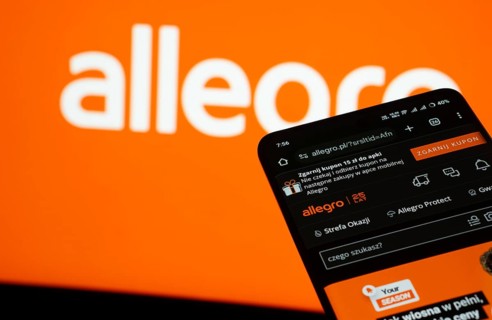 Dhaka, Bangladesh- 03 July 2025: Smartphone displaying Allegro web interface against Allegro logo