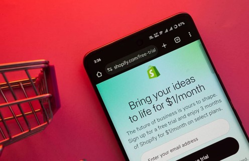 Dhaka, Bangladesh- 23 June 2025: A smartphone displaying the Shopify website with a shopping cart