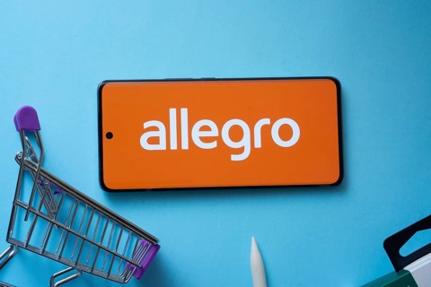Dhaka, Bangladesh- 03 July 2025: Smartphone displaying Allegro logo with shopping cart on a blue