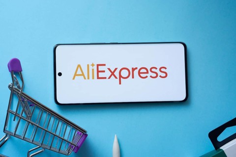Dhaka, Bangladesh- 03 July 2025: Smartphone displaying AliExpress logo with shopping cart on a blue