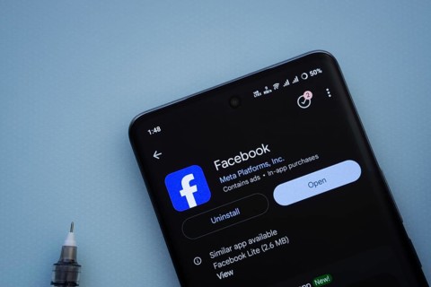 Dhaka, Bangladesh- 29 May 2025: On a blue surface, a smartphone displays the Facebook app within