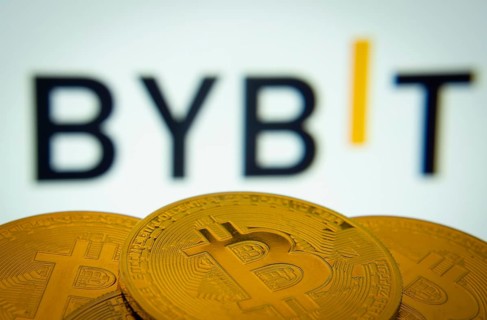 Dhaka, Bangladesh- 15 July 2025: Close-up of Bitcoin coins with the Bybit logo visible on a screen