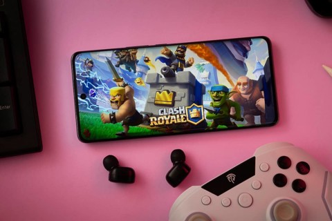 Dhaka, Bangladesh- 15 July 2025: A close-up of a gamepad with the Clash Royale seen on smartphone