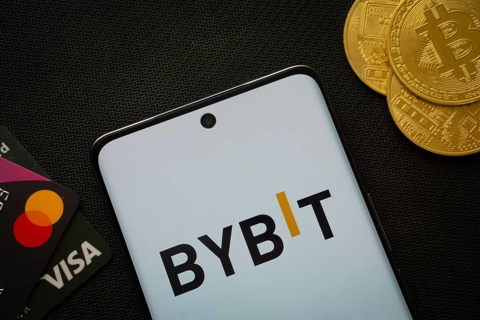 Dhaka, Bangladesh- 15 July 2025: Smartphone displaying Bybit logo surrounded by Bitcoin coins and