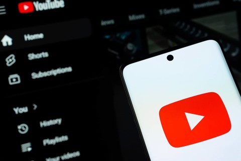Dhaka, Bangladesh- 10 July 2025: Youtube logo is displayed on a smartphone screen, with the website