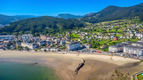 Breathtaking aerial view showcasing the serene beauty of covas beach curving along the coastline,