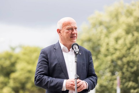 Kai Wegner (Governing Mayor of Berlin) gives a speech in front of the raising of the rainbow flag