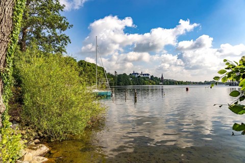 The Great Plön Lake, Nikolai Church and Plön Castle in Plön, Schleswig-Holstein, Germany
