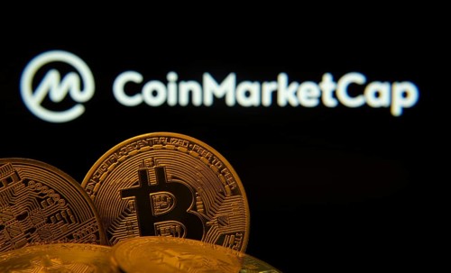 Dhaka, Bangladesh- 27 March 2025: Close-up of Bitcoin coins with the Coinmarketcap logo visible on
