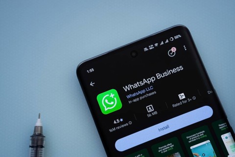 Dhaka, Bangladesh- 29 May 2025: On a blue surface, a smartphone displays the WhatsApp Business app