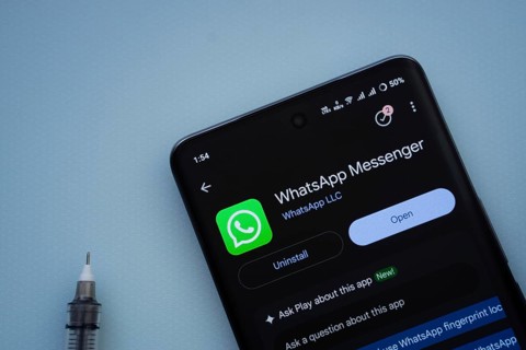 Dhaka, Bangladesh- 29 May 2025: On a blue surface, a smartphone displays the WhatsApp Messenger app