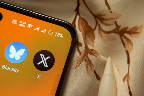 Dhaka, Bangladesh- 07 May 2025: Bluesky and X app icon is seen on smartphone