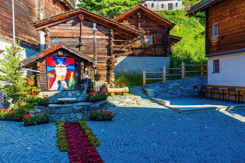 Flower-decorated altar for the Corpus Christi procession, historic village centre, Grimentz, Val