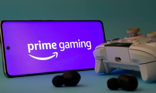 Dhaka, Bangladesh- 22 June 2025: A smartphone with a prime gaming app icon next to a controller and