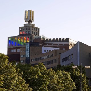 Dortmunder U, Flying pictures by Adolf Winkelmann with green trees, Dortmund, Germany