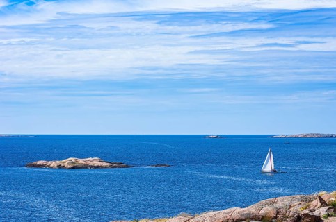Archipelago with sailing boats off the coast of Lysekil, Bohuslän, Västra Götalands län, Sweden,
