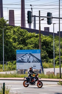 Construction site sign for thyssenkrupp Steel's first direct reduction plant, the climate-neutral