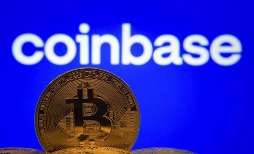Dhaka, Bangladesh- 16 June 2025: Close-up of Bitcoin coins with the Coinbase logo visible on a