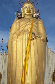 32 metre high standing Buddha decorated with glass mosaics and 24 carat gold, the upper knot of the