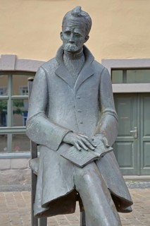 Monument to philosopher Friedrich Nietzsche, bronze sculpture, modern art, standing female figure,