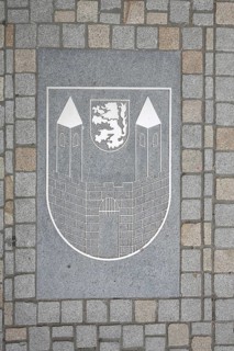 City coat of arms on the ground with paving stones, market square, Weißenfels, Saxony-Anhalt,