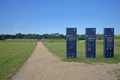 Information board with information on the solar observatory, archaeological reconstruction from the