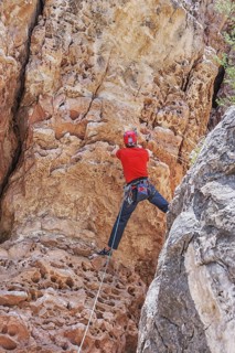 Man rock climbing at The Pit in Sandy's Canyon, Flagstaff, Arizona, USA