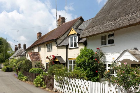 Attractive historic cottages in village of Avebury, Wiltshire, England, UK