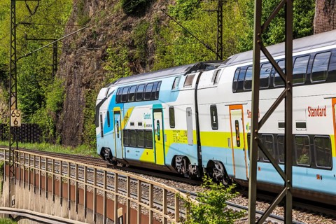 Train of the Austrian Westbahn en route on the winding railway line of the Geislinger Steige.