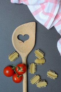 Cooking spoon with heart and Italian pasta, Radiatori variety