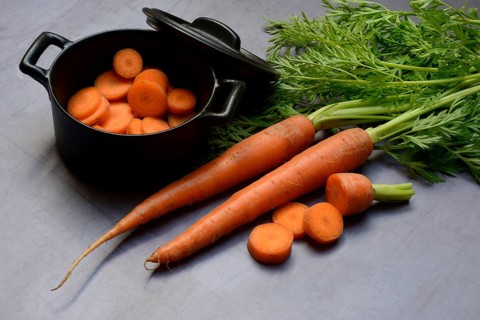 Carrots with leafy greens, carrot slices, Daucus carota