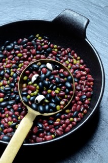 Various beans in ladle, dried beans