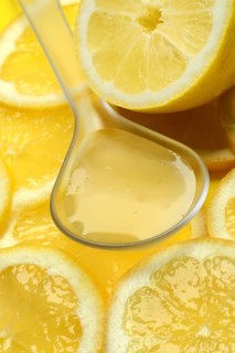 Lemon juice in ladle and lemon slices, Citrus x limon