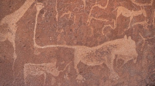 Detail, rock engraving of a lion, depictions of animals on a rock slab, lion slab, petroglyphs,